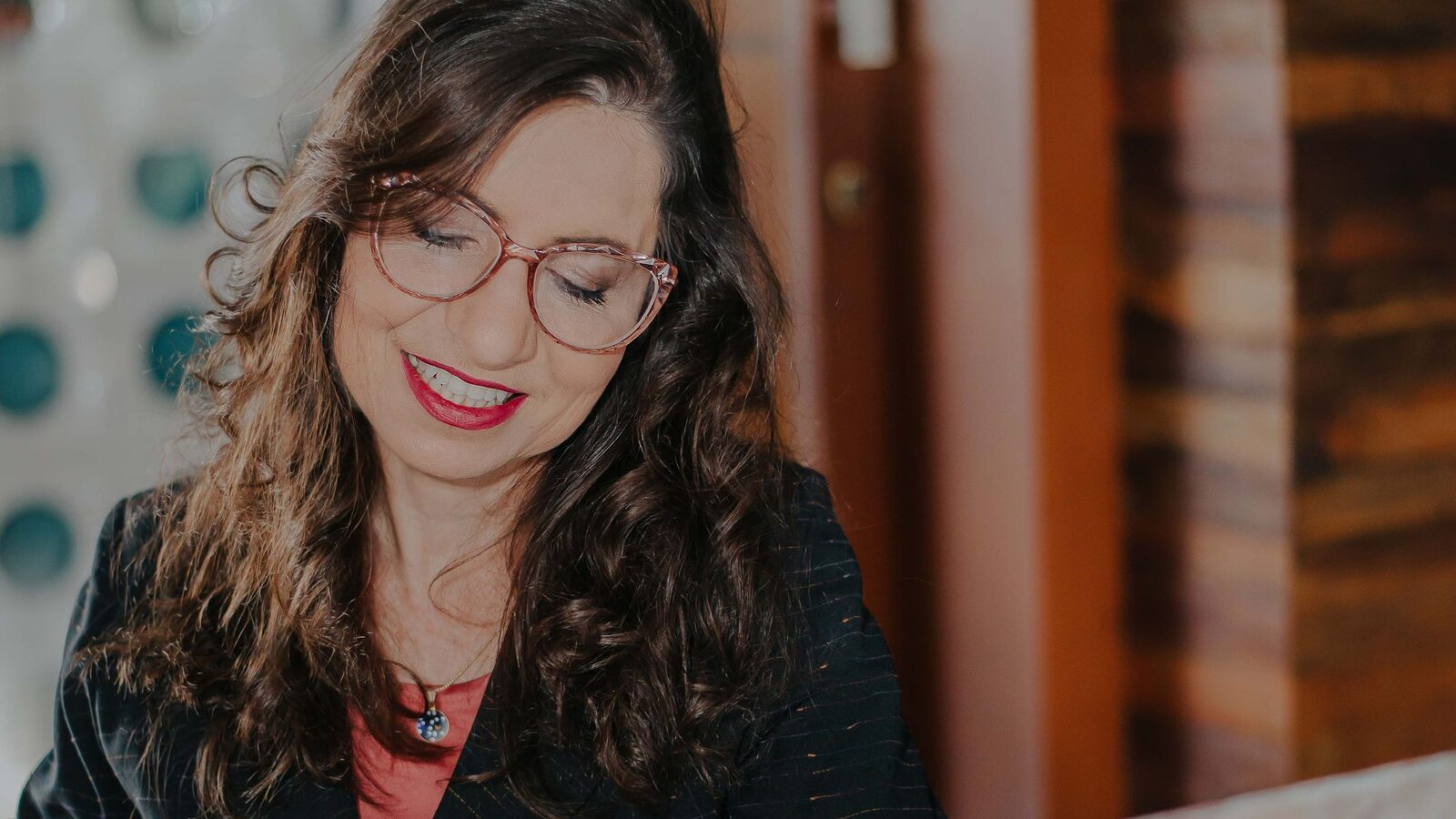 Businesswoman smiling as she replies to a message