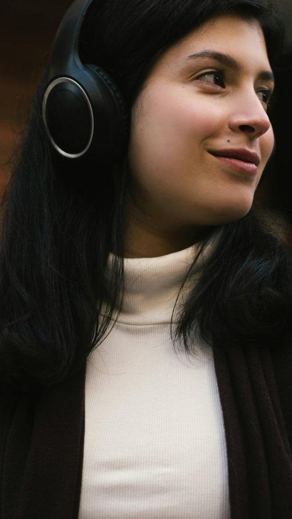 Woman with headphones replying to a message